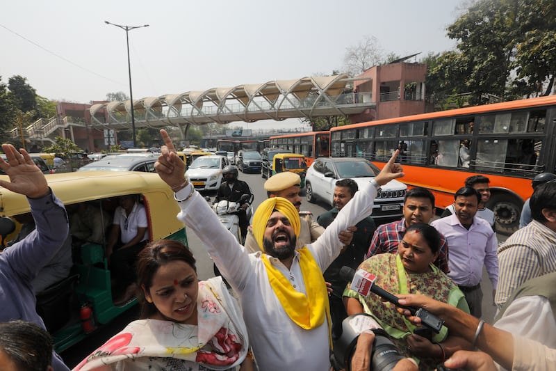 AAP supporters block a road during the protests. EPA