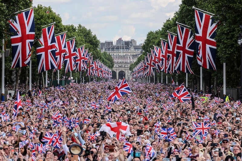 Thousands wait for the royal family to appear on the balcony of Buckingham Palace, on the first day of celebrations to mark Queen Elizabeth II's platinum jubilee. AP