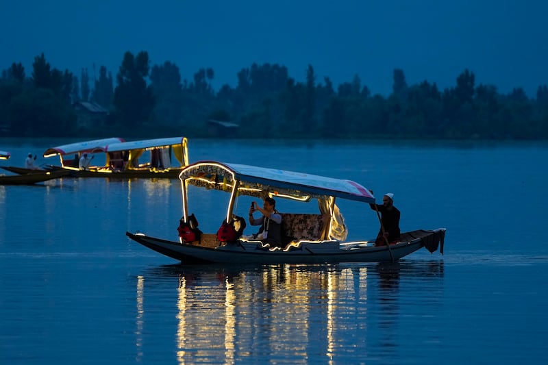 A delegate from the Group of 20 nations tourism meeting takes boat trip on Dal Lake in Srinagar, Indian-administered Kashmir. AP