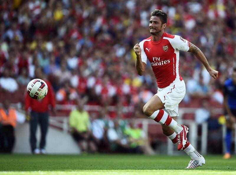Arsenal's Olivier Giroud chases the ball against Monaco during their Emirates Cup soccer match at the Emirates stadium in London August 3, 2014. REUTERS/Dylan Martinez