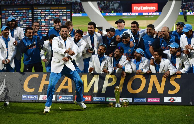 BIRMINGHAM, ENGLAND - JUNE 23:  Virat Kohli of India celebrates victory with team mates during the ICC Champions Trophy Final between England and India at Edgbaston on June 23, 2013 in Birmingham, England.  (Photo by Gareth Copley/Getty Images) *** Local Caption ***  171226666.jpg