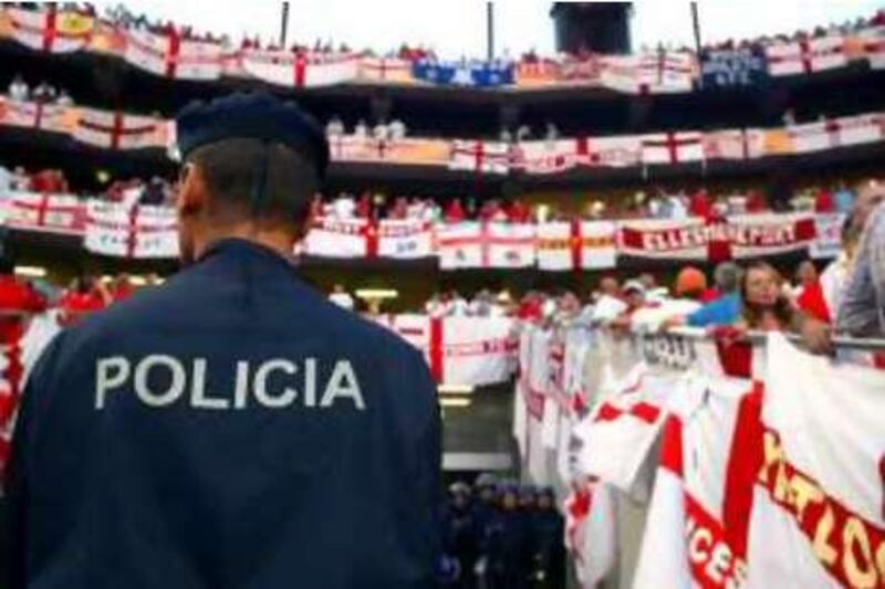 England's fans are closely guarded by the police during the Euro 2004 Soccer / Football Championship in Portugal.

Matthew Ashton / PA

REF rv29AU-football 29/08/08
