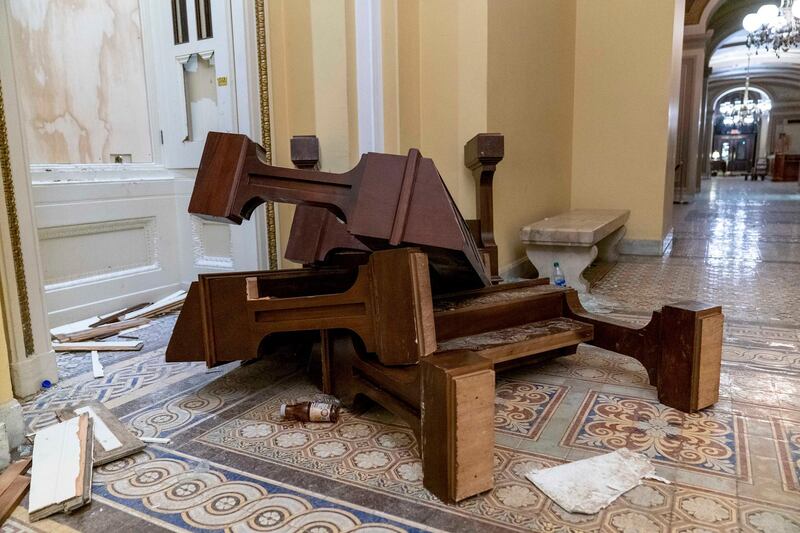 Damage is visible in the early morning hours of Thursday, Jan. 7, 2021, after protesters stormed the Capitol in Washington, on Wednesday. (AP Photo/Andrew Harnik)