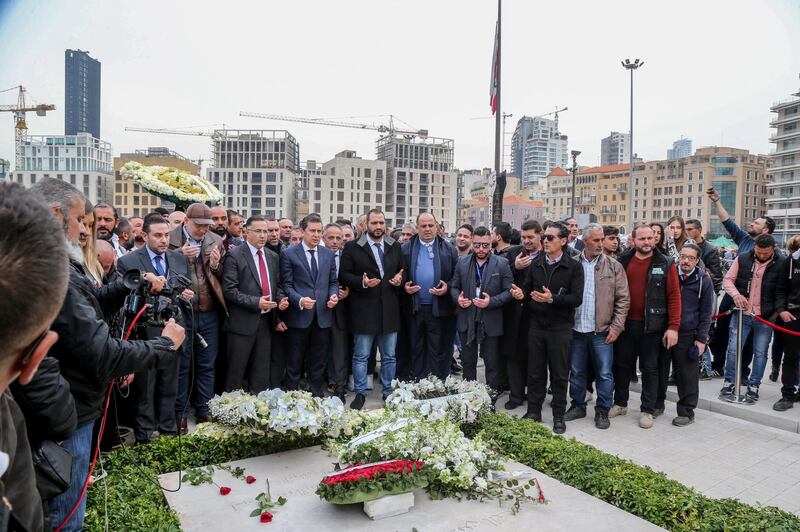 Supporters of Al-mustaqbal (Future) Movement read a verse of the Quran next to the grave of late former Prime Minister Rafic Hariri in downtown Beirut, Lebanon.  EPA