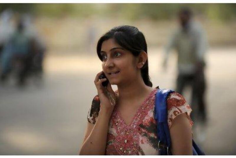 A young Indian woman talks on her cellular telephone in Allahabad, near Lucknow.