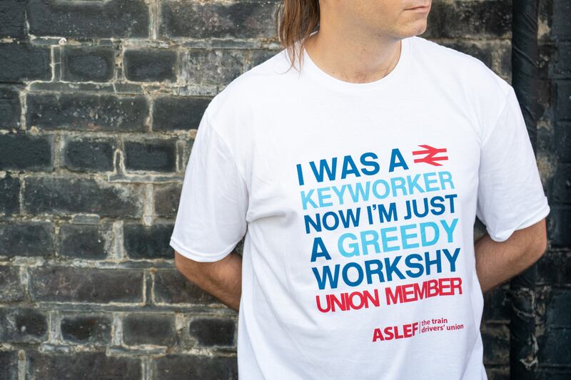 An Aslef member at a picket line at Willesden Junction Station in London on a 24-hour strike over pay.