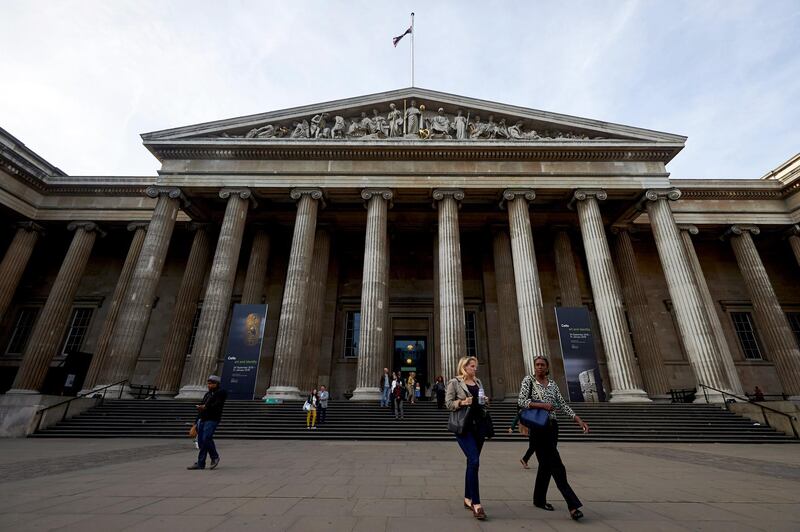 People walk down the south steps away from the main entrance of the British Museum in central London on September 29, 2015. Hartwig Fischer who has become the first non-Briton to lead the prestigious British Museum in 150 years, is a discreet man who has built a reputation as one of the most renowned museum directors in Germany. AFP PHOTO / NIKLAS HALLE'N / AFP PHOTO / NIKLAS HALLE'N