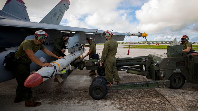 US troops load a High-speed Anti-Radiation Missile onto an aircraft. The weapons have bolstered Ukraine's counter-offensive against Russia.  Alamy