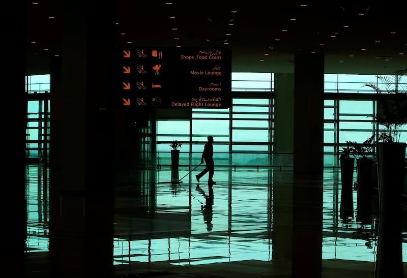 A worker cleans the floor of the newly built Islamabad International Airport, during a media tour  ahead of its official opening, Pakistan April 18, 2018. REUTERS/Faisal Mahmood     TPX IMAGES OF THE DAY