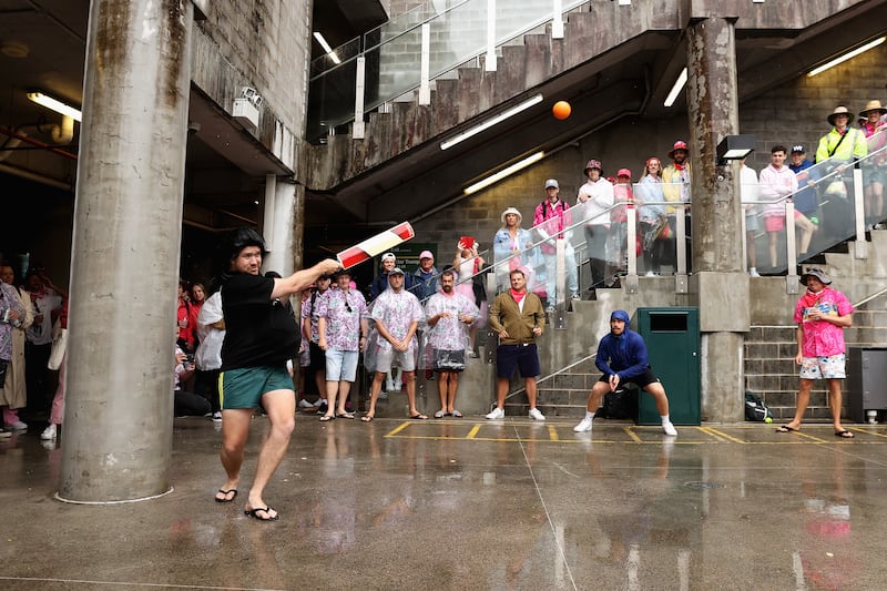 An impromptu game of cricket during a rain delay in the third Test between Australia and South Africa in Sydney. Getty Images