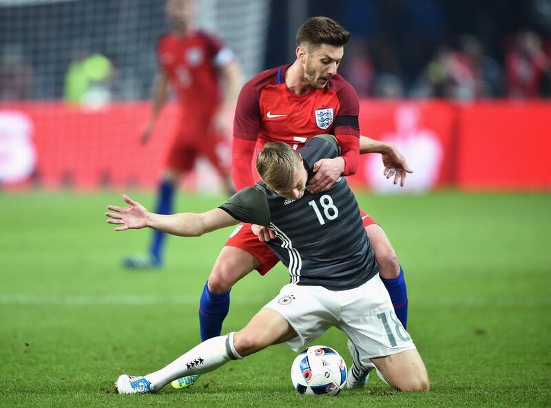 Toni Kroos of Germany and Adam Lallana of England compete for the ball during the International Friendly match between Germany and England at Olympiastadion on March 26, 2016 in Berlin, Germany.  (Photo by Stuart Franklin/Bongarts/Getty Images)