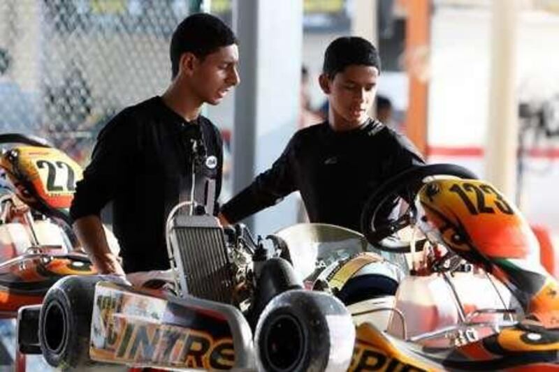 Brothers Sanad, 15, left, and Abdullah al Rawahi, 13, have the financial and physical support of their doting father in pursuing their Formula One dreams.