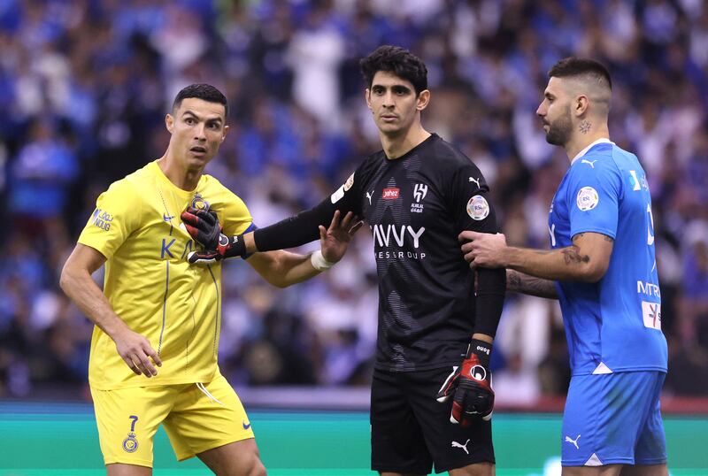 Al Nassr's Cristiano Ronaldo, left, tussled with Al Hilal goalkeeper Bono and striker Aleksandar Mitrovic. Reuters