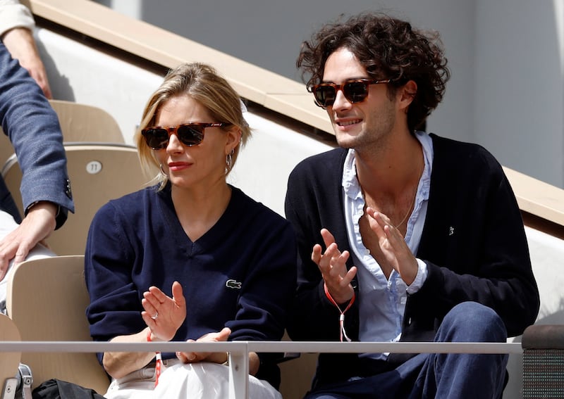 Actress Sienna Miller and Oli Green in Paris on Sunday. Reuters