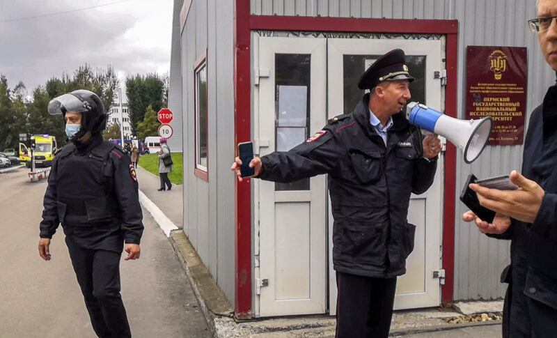 Police officers guard the scene in Perm. AFP