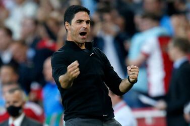 Arsenal's Spanish manager Mikel Arteta celebrates on the final whistle in the English Premier League football match between Arsenal and Tottenham Hotspur at the Emirates Stadium in London on September 26, 2021.  - Arsenal won the game 3-1.  (Photo by Ian KINGTON / IKIMAGES / AFP) / RESTRICTED TO EDITORIAL USE.  No use with unauthorized audio, video, data, fixture lists, club/league logos or 'live' services.  Online in-match use limited to 45 images, no video emulation.  No use in betting, games or single club/league/player publications. 