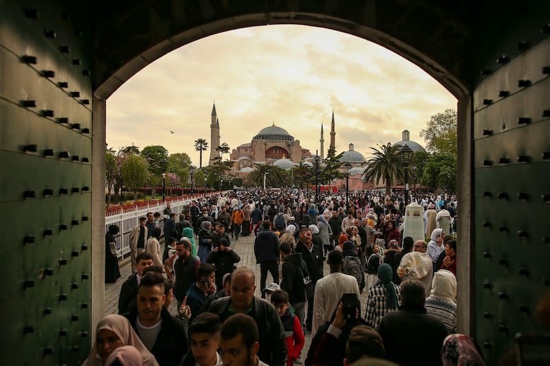 Muslims on the first day of Eid Al Fitr outside the Haghia Sophia Mosque in Istanbul. AP