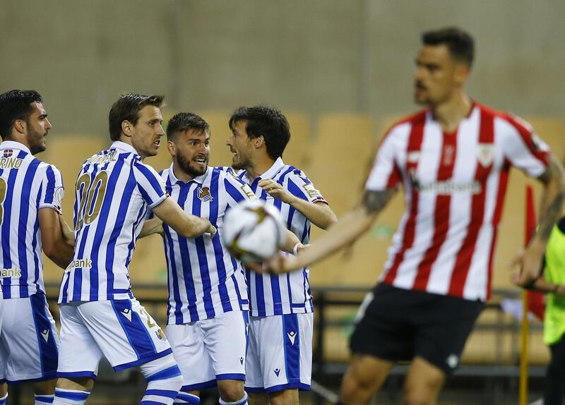 Real Sociedad's Mikel Oyarzabal celebrates scoring their first goal with teammates. Reuters