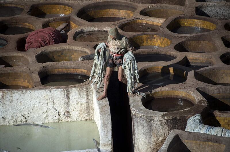 A man works in the tannery in the 9th century walled medina in the ancient Moroccan city of Fez on April 11, 2019. AFP