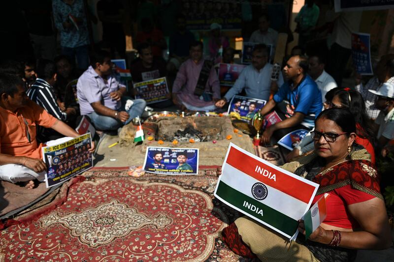 Cricket fans pray for an India victory in New Delhi. AFP