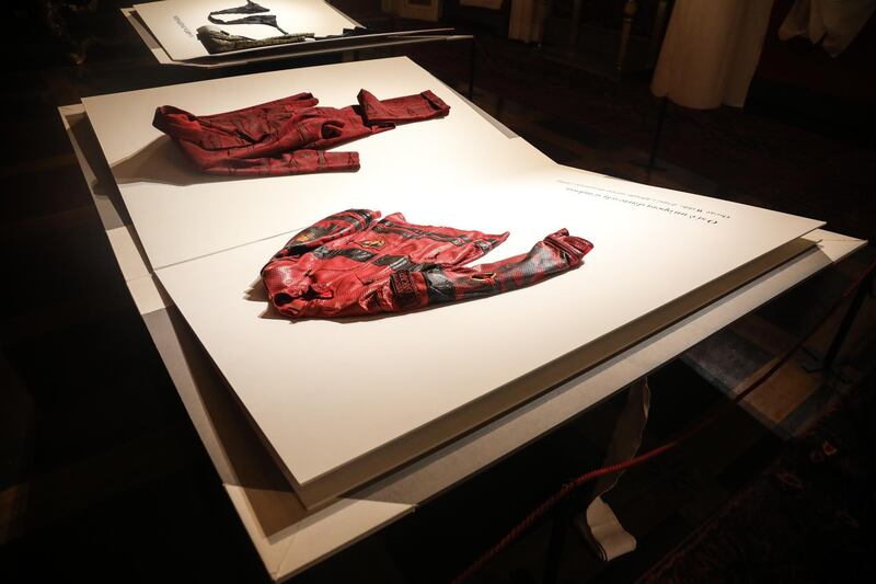 Custom-created book pages replace mannequins in A Short Novel on Men’s Fashion exhibition. Courtesy Pitti Immagine Uomo