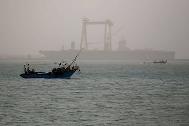 A boat is seen on a dusty weather in Suez near the Suez Canal, Egypt. The recent spike to oil prices from the disruption to Suez traffic has lifted prices, which remained bearish following renewed concerns of Covid-19 infections. REUTERS/Amr Abdallah Dalsh