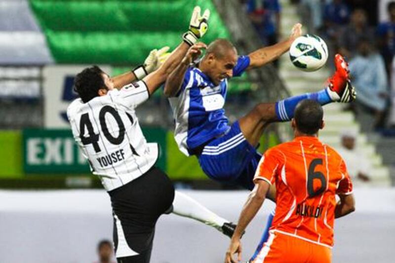 Ajman scramble to clear an Al Nasr attack.