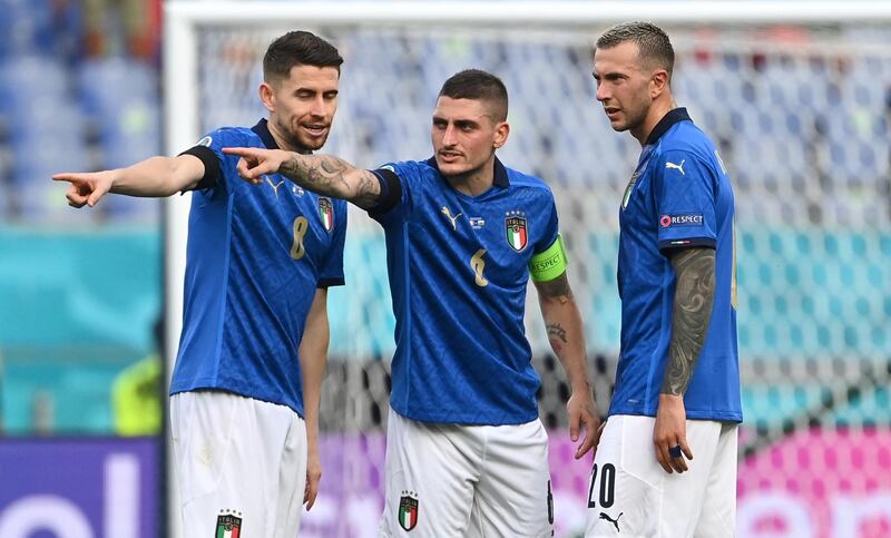 ROME, ITALY - JUNE 20: Jorginho, Marco Verratti and Federico Bernardeschi of Italy look on during the UEFA Euro 2020 Championship Group A match between Italy and Wales at Olimpico Stadium on June 20, 2021 in Rome, Italy. (Photo by Andreas Solaro - Pool/Getty Images)