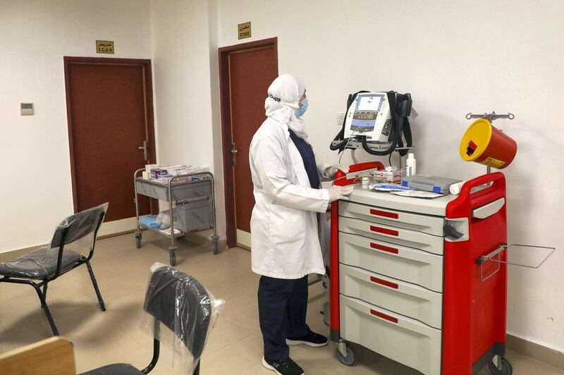 Palestinian medical staff are pictured in the newly opened Red Crescent Hospital dedicated to coronavirus, in the occupied-West Bank city of Nablus on January 16, 2021. - The Palestinian health ministry has recorded more than 102,000 cases coronavirus cases in the West Bank, including 1,164 deaths. (Photo by JAAFAR ASHTIYEH / AFP)