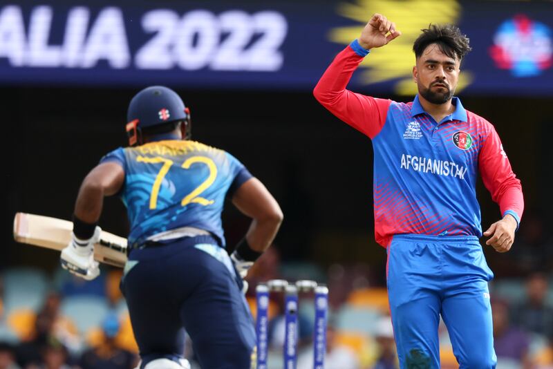 Afghanistan's Rashid Khan celebrates after bowling to Sri Lanka's Charith Asalanka. AP