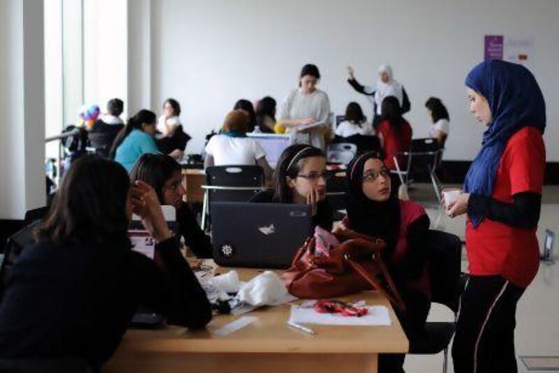 Young women work on projects as part of a 'Women's Start-up Weekend' at Algeria 2.0, an event designed to encourage entrepreneurship.