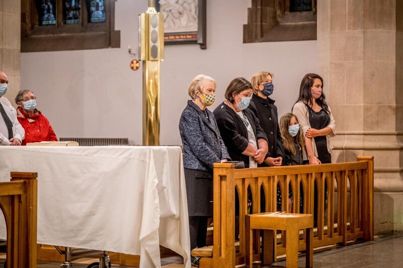 Pat Hume, left, is pictured alongside family members as her late husband John Hume lies at rest in St Eugene's Cathedral. Getty Images