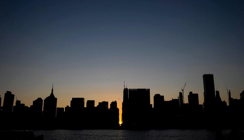 The sun sets behind 42nd Street in Manhattan during a power outage in New York City. AFP