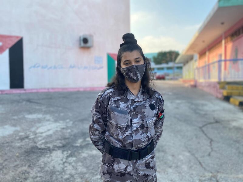 Hana’a Abed stands outside her school in Al Baqa’a camp. Amy McConaghy/ The National