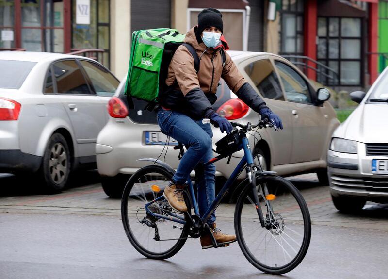 Venezuela's 2012 Olympic champion in fencing, Ruben Limardo Gascon, delivers food to support his family as he lives and trains in Poland and plans to win a medal at the upcoming Tokyo Olympics. AP