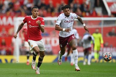 MANCHESTER, ENGLAND - SEPTEMBER 25: Mason Greenwood of Manchester United battles for possession with Tyrone Mings of Aston Villa   during the Premier League match between Manchester United and Aston Villa at Old Trafford on September 25, 2021 in Manchester, England. (Photo by Gareth Copley / Getty Images)