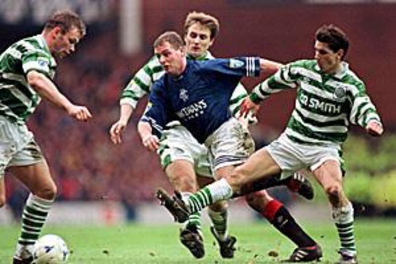 Paul Gascoigne, in blue, is one of the many great players to grace the famous Old Firm derby.