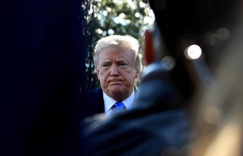 U.S. President Donald Trump listens to a question from members of the media before boarding Marine One on the South Lawn of the White House in Washington, D.C., U.S., on Saturday, Oct. 13, 2018. Trump said the U.S. would be "foolish" to cancel large arms deals with Saudi Arabia in response to the controversy surrounding the fate of Washington Post writer Jamal Khashoggi. Photographer: Olivier Douliery/Pool via Bloomberg