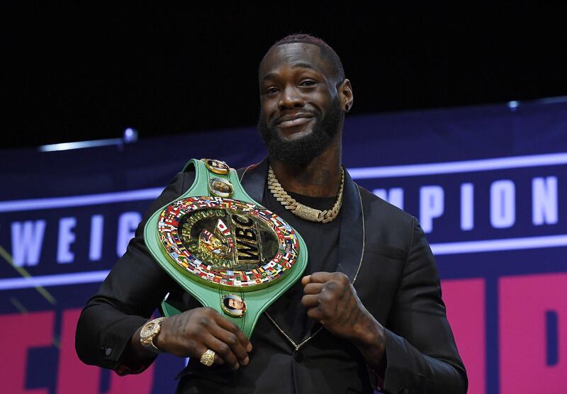 Deontay Wilder poses with the belt. AFP