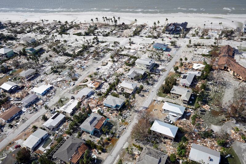 Damaged homes and debris in the aftermath of the hurricane. AP Photo