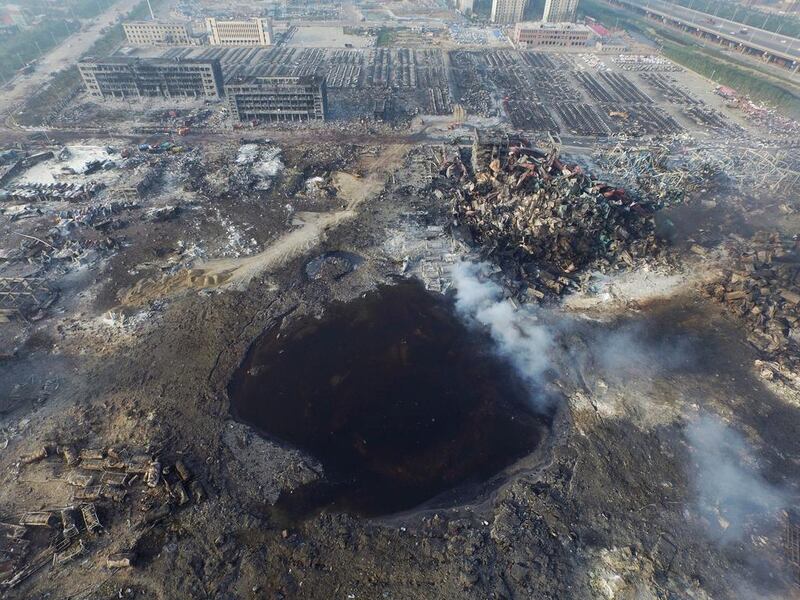 An aerial view of a crater left in the ground after a huge explosion rocked the Chinese port city of Tianjin on August 15, 2015. STR China Out/EPA