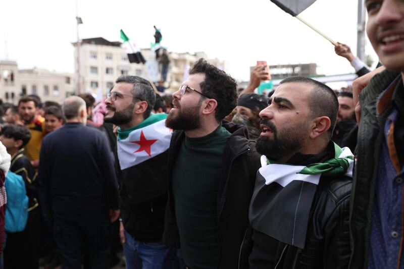 Syrians gather to commemorate the ten years anniversary of the uprising against the Syrian government, in Idlib. EPA