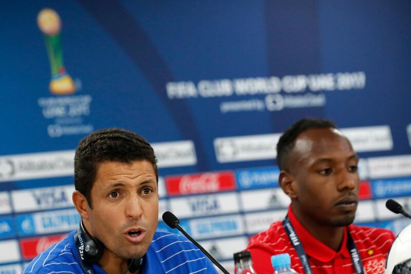 Morocco's Wydad Athletic Club head coach Hussein Amotta, left, speaks during a press conference with his player Abdeladim Khadrouf at Zayed sport city in Abu Dhabi, United Arab Emirates, Friday, Dec. 8, 2017. Wydad Athletic Club will play Pachuca in a second round of the FIFA Club World Cup soccer tournament. (AP Photo/Hassan Ammar)