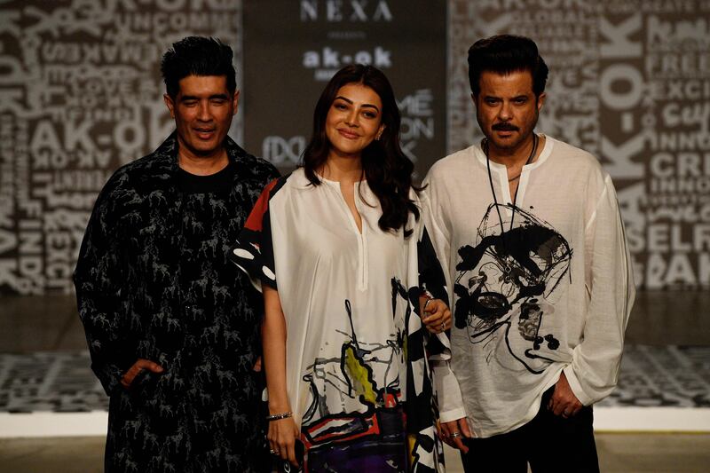 Designer Manish Malhotra, left, with actors Kajal Aggarwal and Anil Kapoor at Anamika Khanna's show