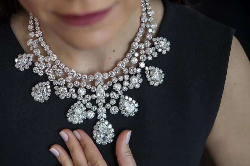 An employee displays a diamond necklace, Harry Winston, circa 1973, set with eight pear-shaped diamonds weighing from 3.77 to 20.72 carats representing a total of 280 carats. EPA