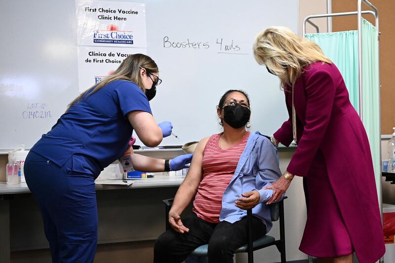 US first lady Jill Biden speaks to a woman receiving a Covid-19 vaccine during her visit to a vaccination centre in Albuquerque, New Mexico, on April 21, 2021. Reuters