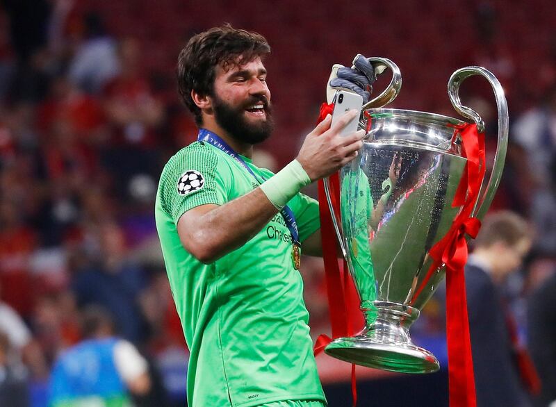 Alisson with the European Cup. Reuters