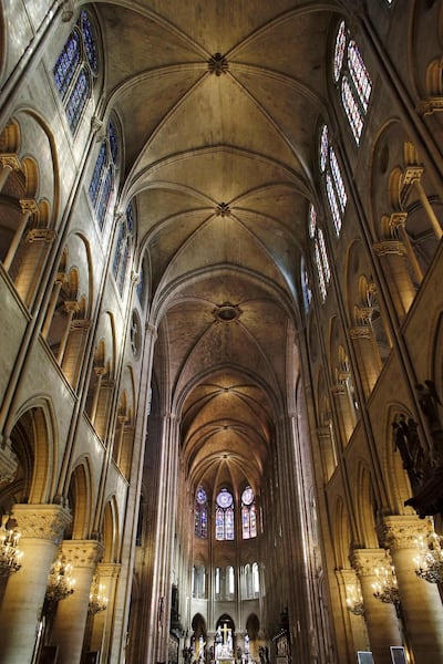(FILES) This file photo taken on November 29, 2012 shows a view of the inside of the Notre-Dame de Paris cathedral in Paris.    A huge fire swept through the roof of the famed Notre-Dame Cathedral in central Paris on April 15, 2019, sending flames and huge clouds of grey smoke billowing into the sky. The flames and smoke plumed from the spire and roof of the gothic cathedral, visited by millions of people a year.  / AFP / PATRICK KOVARIK
