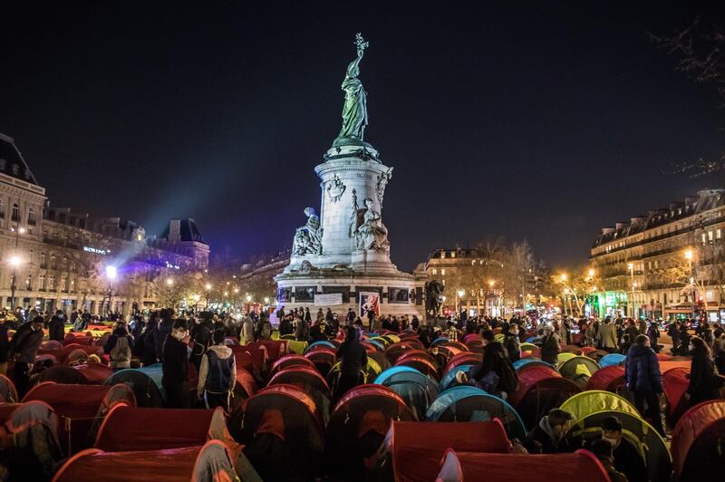 Migrants and their supporters set up tents to form a makeshift migrant camp on Place de la Republique in Paris, France. EPA