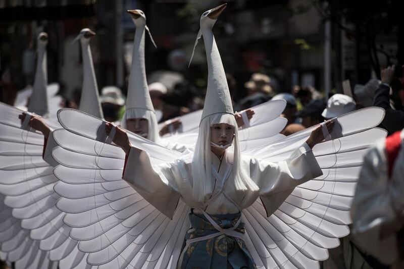 Heron-hooded dancers parade during the Sanja Matsuri festival in Tokyo. Fred Dufour / AFP Photo